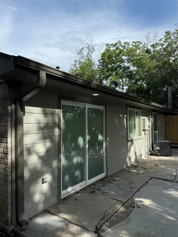 a black car parked in front of building
