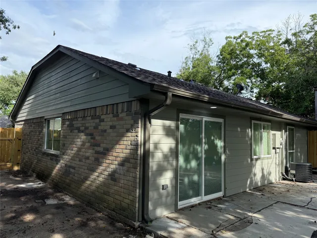 a kitchen with a stove and white cabinets