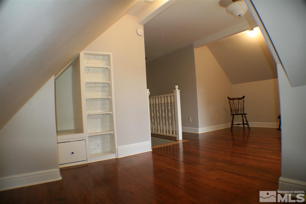602 John Fremont Drive, Unit RENO NV Reno, NV 89509 - Photo 14 of 24 a view of empty room with wooden floor