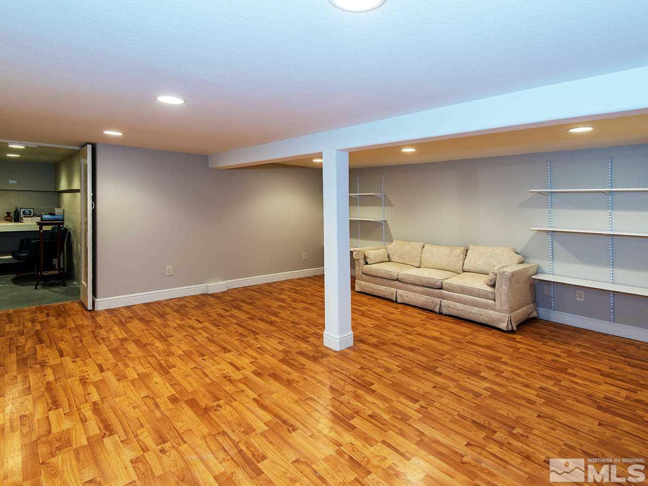 602 John Fremont Drive, Unit RENO NV Reno, NV 89509 - Photo 24 of 24 a bedroom with a bed and a view of living room