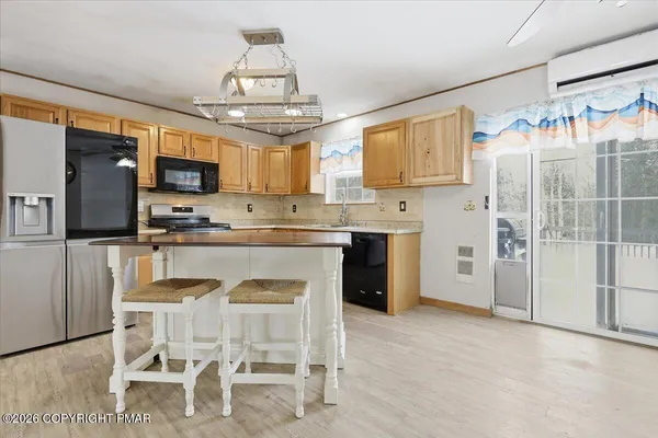 a kitchen with stainless steel appliances granite countertop a sink and a window