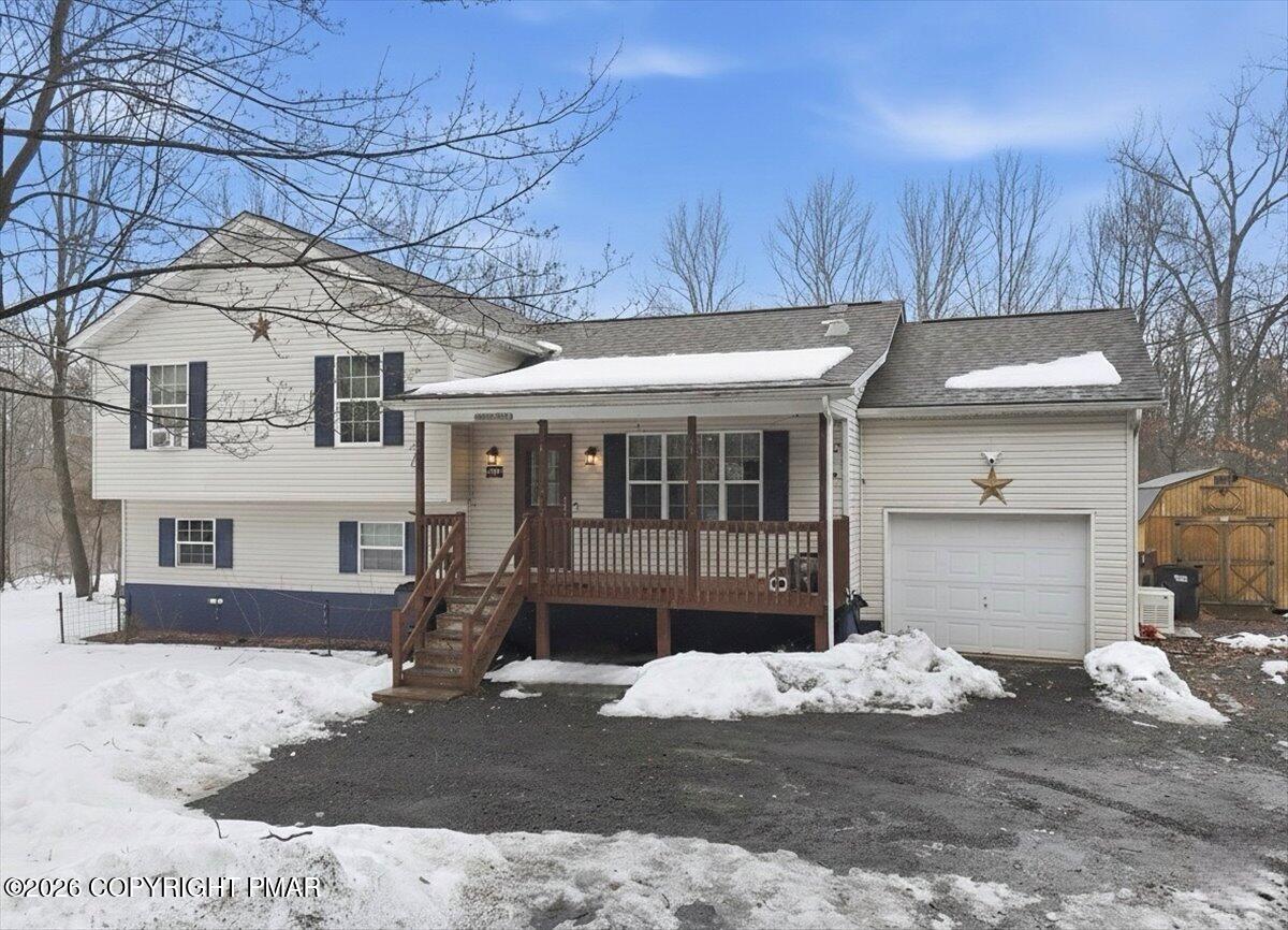 199 Magic Mountain Road Henryville, PA 18332 - Photo 2 of 74 a front view of a house with a yard