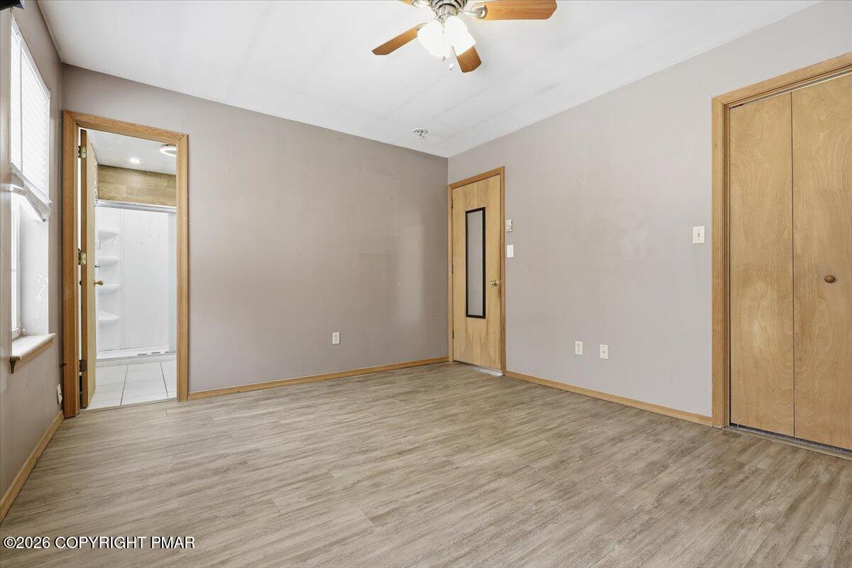 199 Magic Mountain Road Henryville, PA 18332 - Photo 25 of 74 a view of an empty room with window and wooden floor
