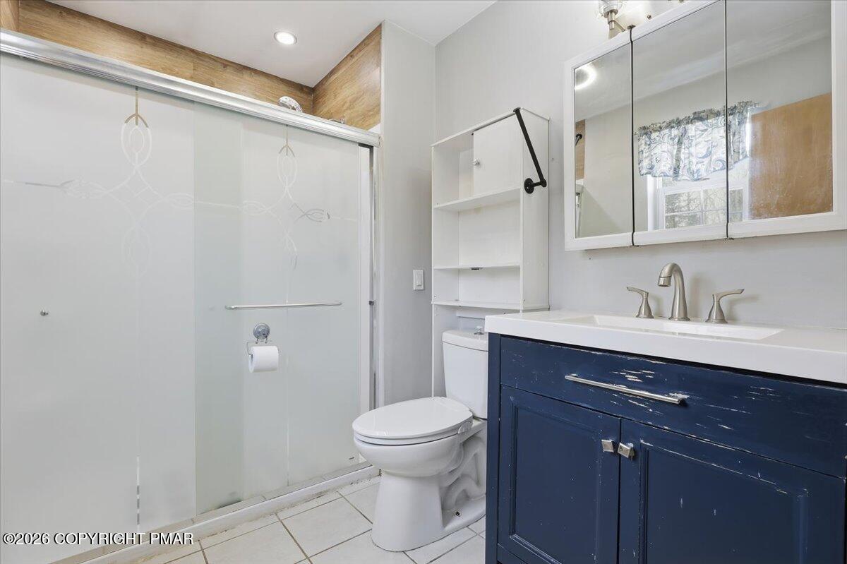 199 Magic Mountain Road Henryville, PA 18332 - Photo 27 of 74 a bathroom with a sink a toilet and shower
