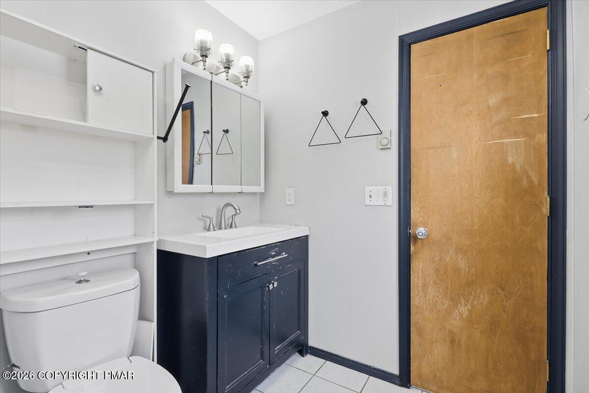 199 Magic Mountain Road Henryville, PA 18332 - Photo 28 of 74 a bathroom with a sink a toilet and mirror