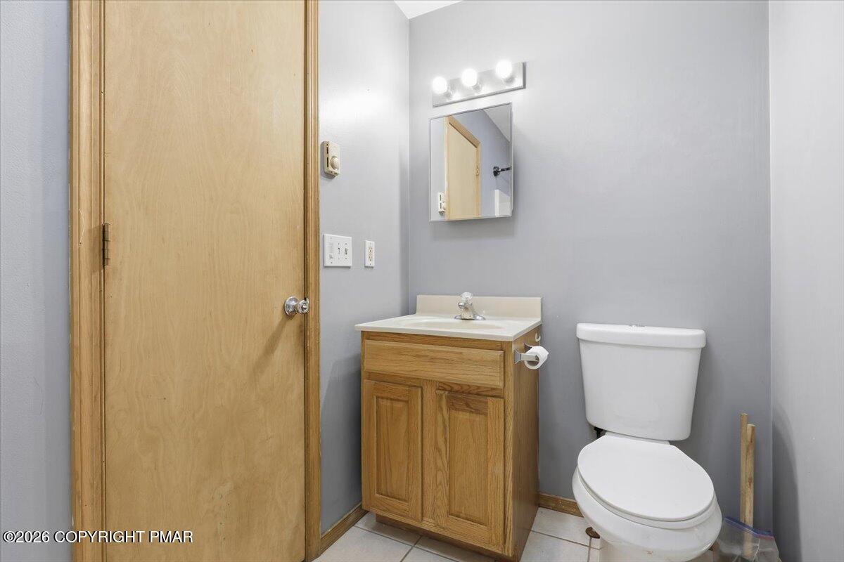 199 Magic Mountain Road Henryville, PA 18332 - Photo 35 of 74 a white toilet sitting next to a bathroom sink