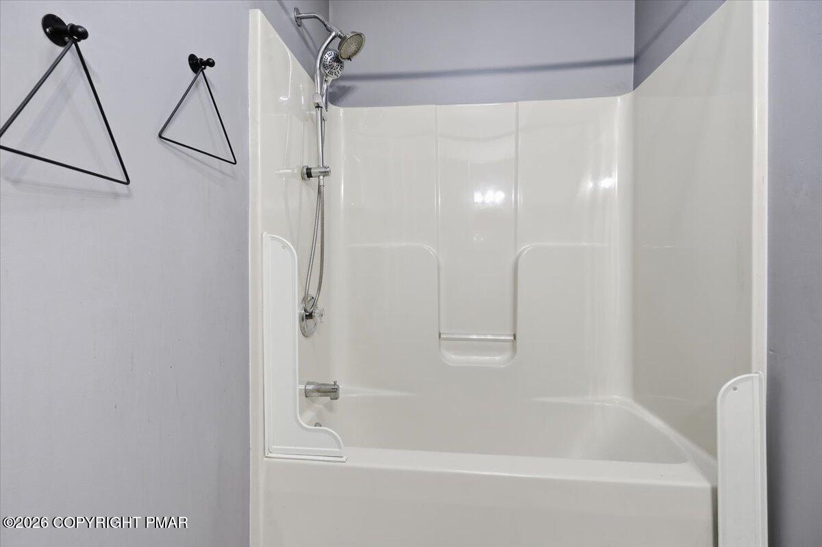 199 Magic Mountain Road Henryville, PA 18332 - Photo 36 of 74 a bathroom with a bathtub