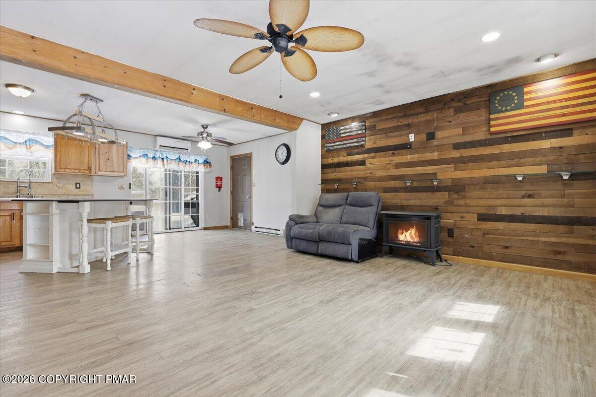 199 Magic Mountain Road Henryville, PA 18332 - Photo 5 of 74 a living room with furniture and a fireplace