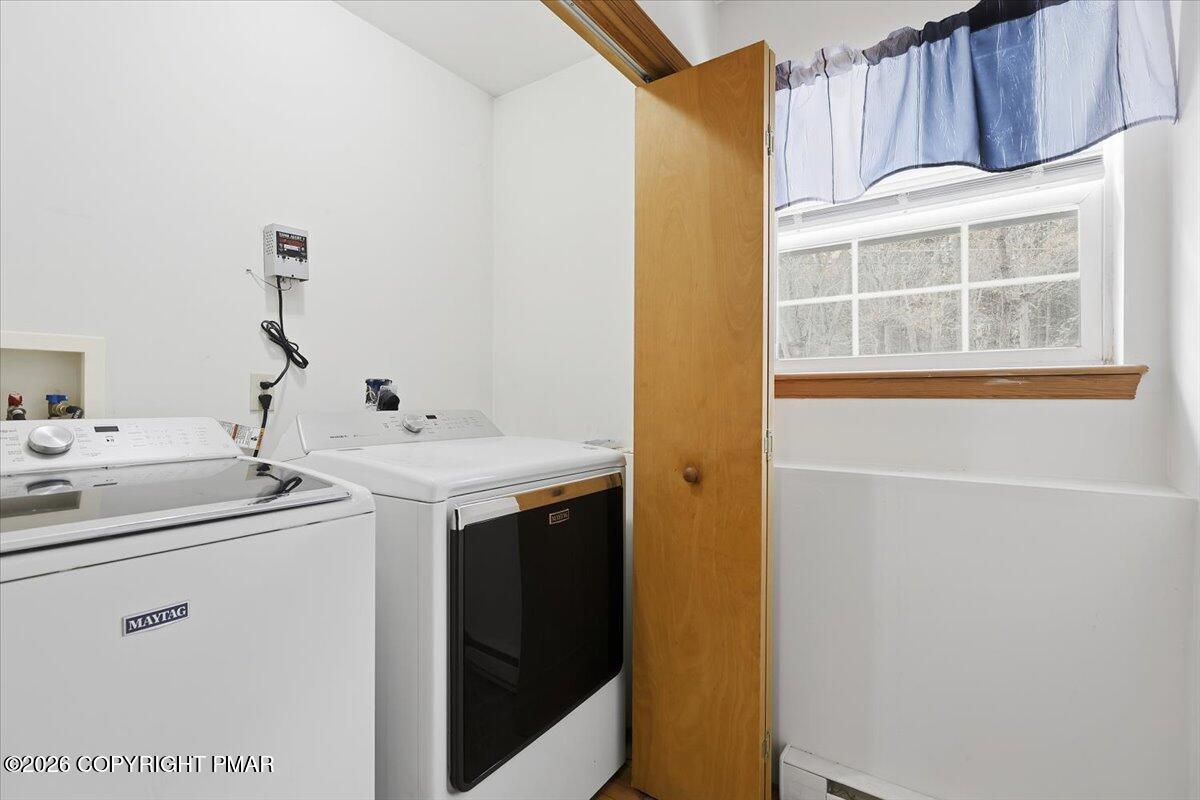 199 Magic Mountain Road Henryville, PA 18332 - Photo 53 of 74 a utility room with dryer and washer