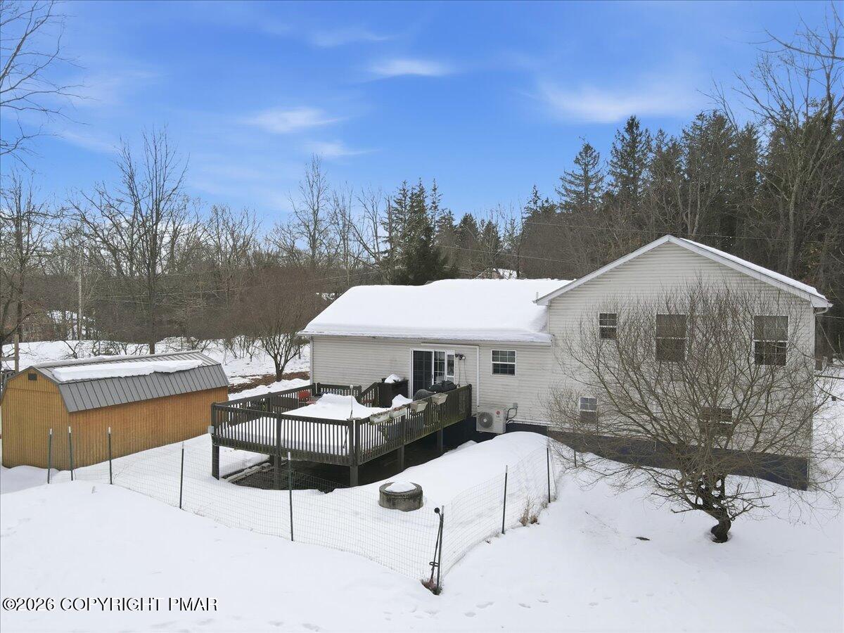 199 Magic Mountain Road Henryville, PA 18332 - Photo 61 of 74 a backyard of a house with table and chairs
