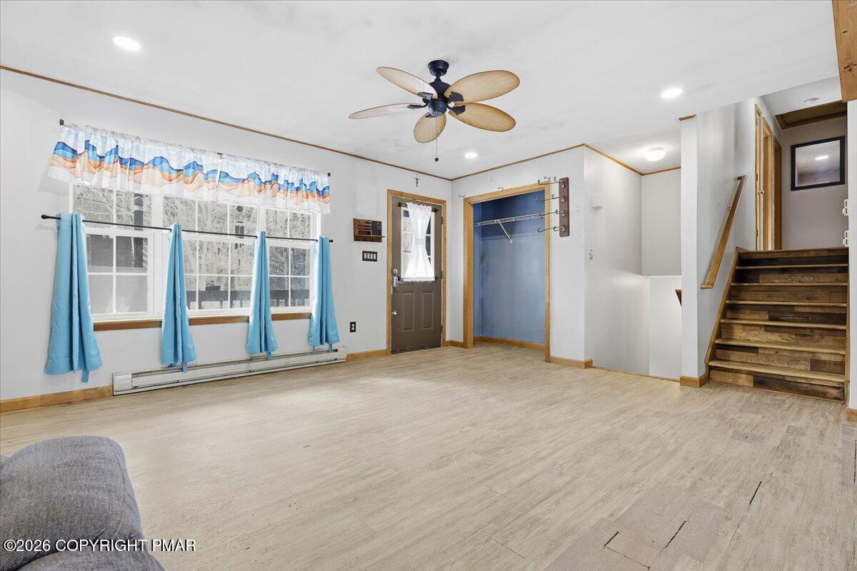 199 Magic Mountain Road Henryville, PA 18332 - Photo 9 of 74 a view of an empty room with a ceiling fan