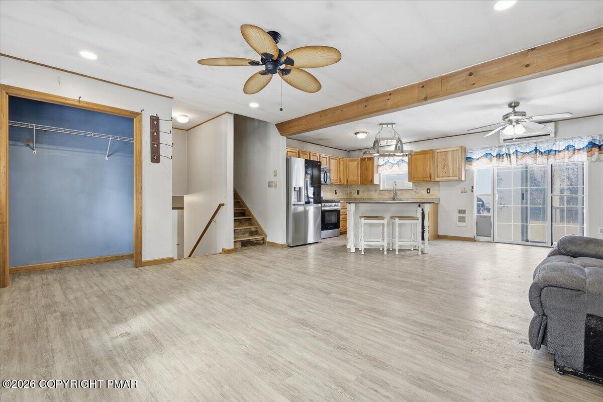 199 Magic Mountain Road Henryville, PA 18332 - Photo 10 of 74 a view of a livingroom with furniture and a ceiling fan