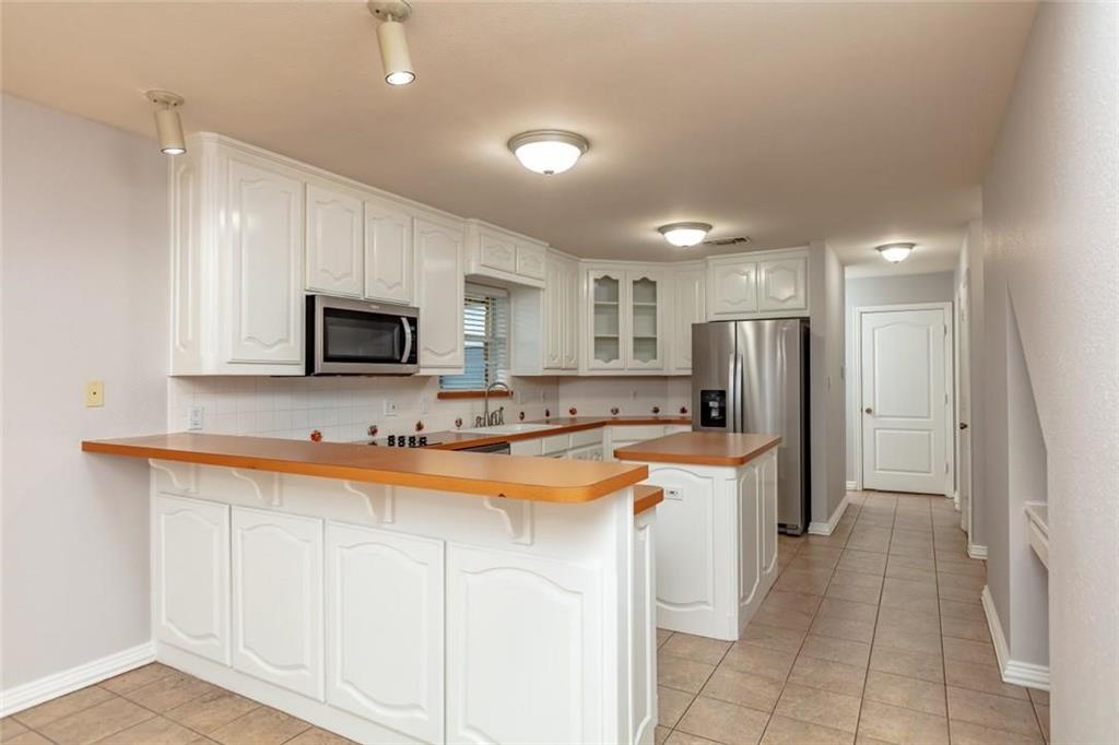 123 Double Tree Lane Lipan, TX 76462 - Photo 16 of 25 Kitchen floor has been updated with Vinyl Plan flooring