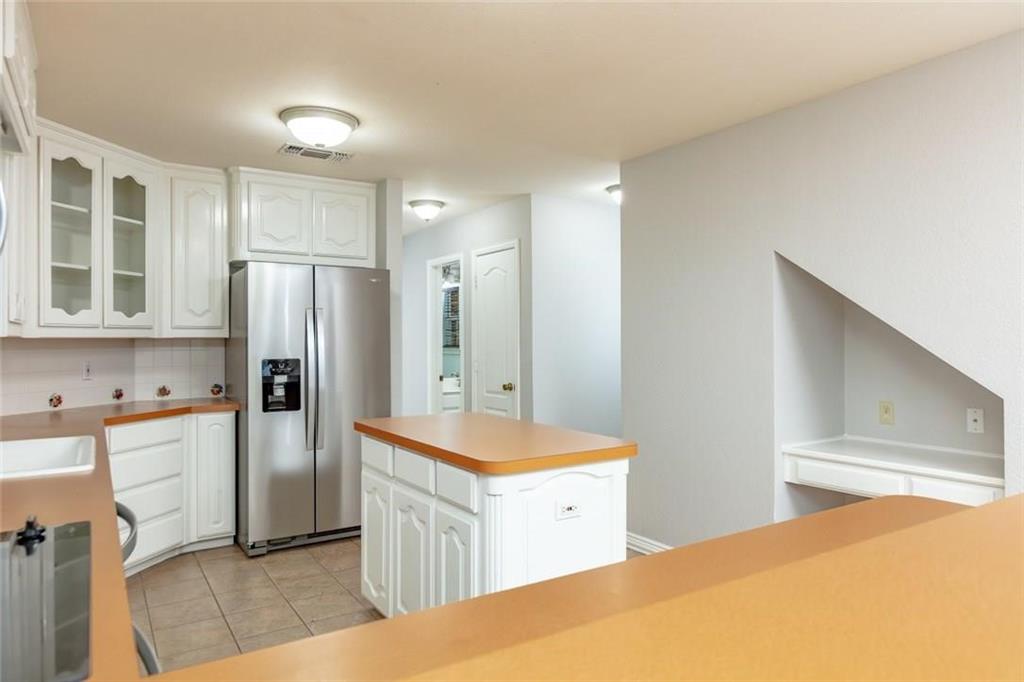 123 Double Tree Lane Lipan, TX 76462 - Photo 17 of 25 Multiple cabinets will accommodate ALL your kitchen equipment - PLUS a Pantry