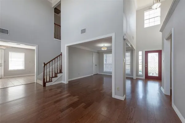 a view interior of a house with wooden floor and windows