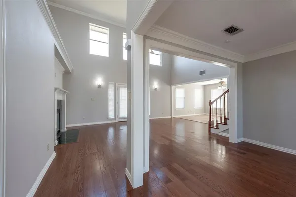 a view of gallery with wooden floor