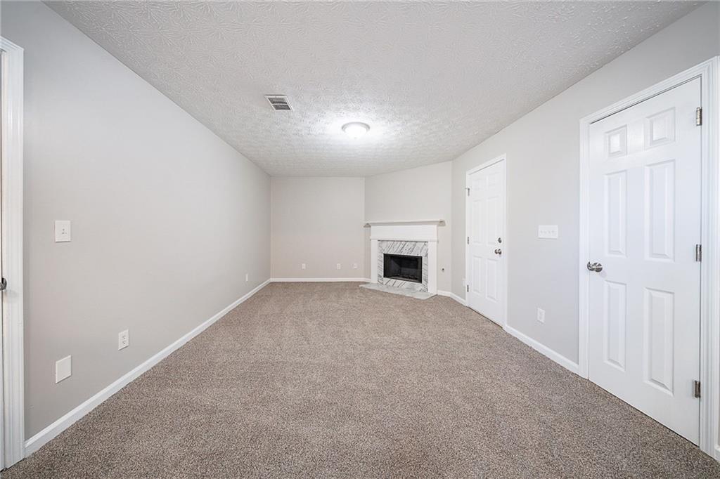 2183 Ramblewood Circle Decatur, GA 30035 - Photo 19 of 37 a view of empty room with a fireplace