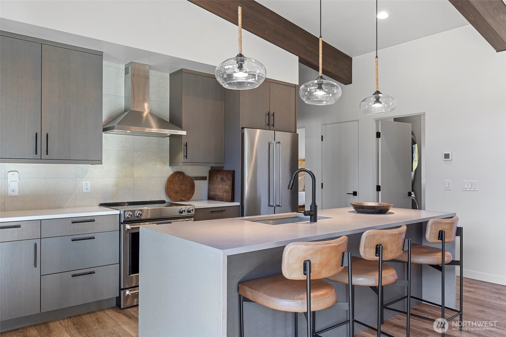 10695 Eagle Creek Road Leavenworth, WA 98826 - Photo 14 of 39 a kitchen with a dining table a sink and cabinets
