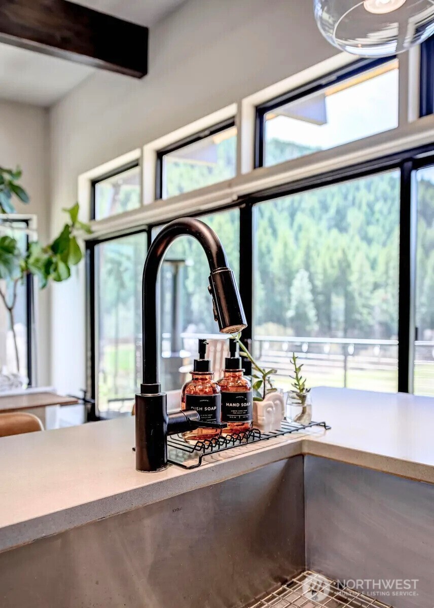 10695 Eagle Creek Road Leavenworth, WA 98826 - Photo 17 of 39 a view of a swimming pool with a lounge chair