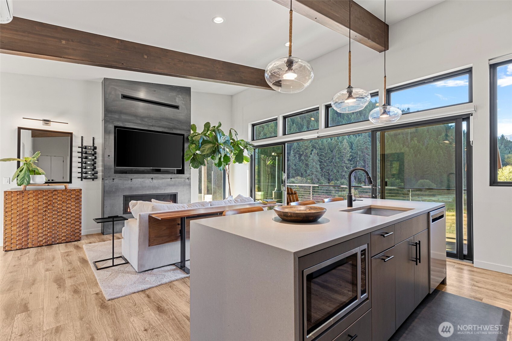 10695 Eagle Creek Road Leavenworth, WA 98826 - Photo 18 of 39 a view of living room kitchen with a sink and chandelier
