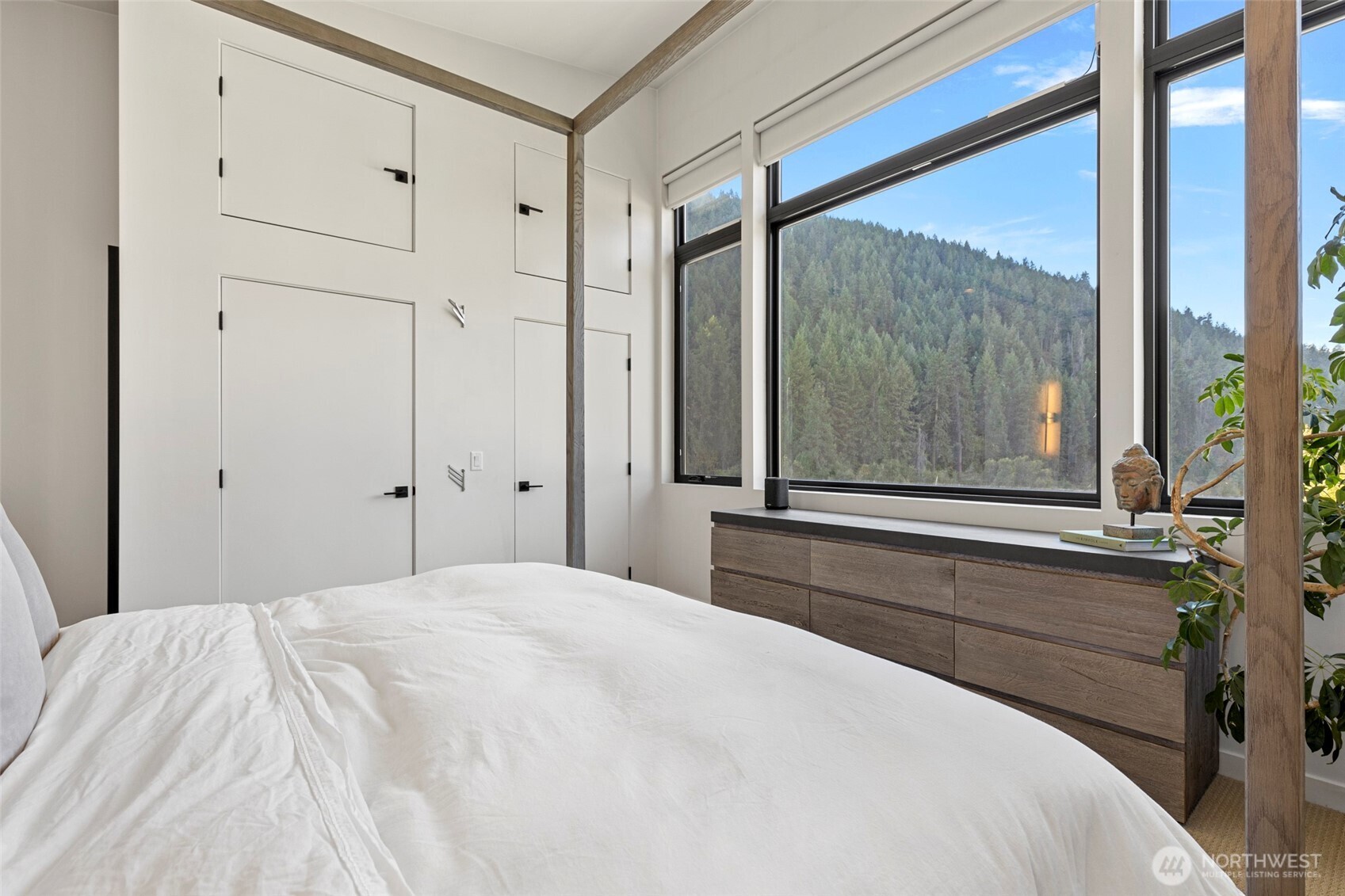 10695 Eagle Creek Road Leavenworth, WA 98826 - Photo 25 of 39 a bedroom with a bed and a large window with balcony view