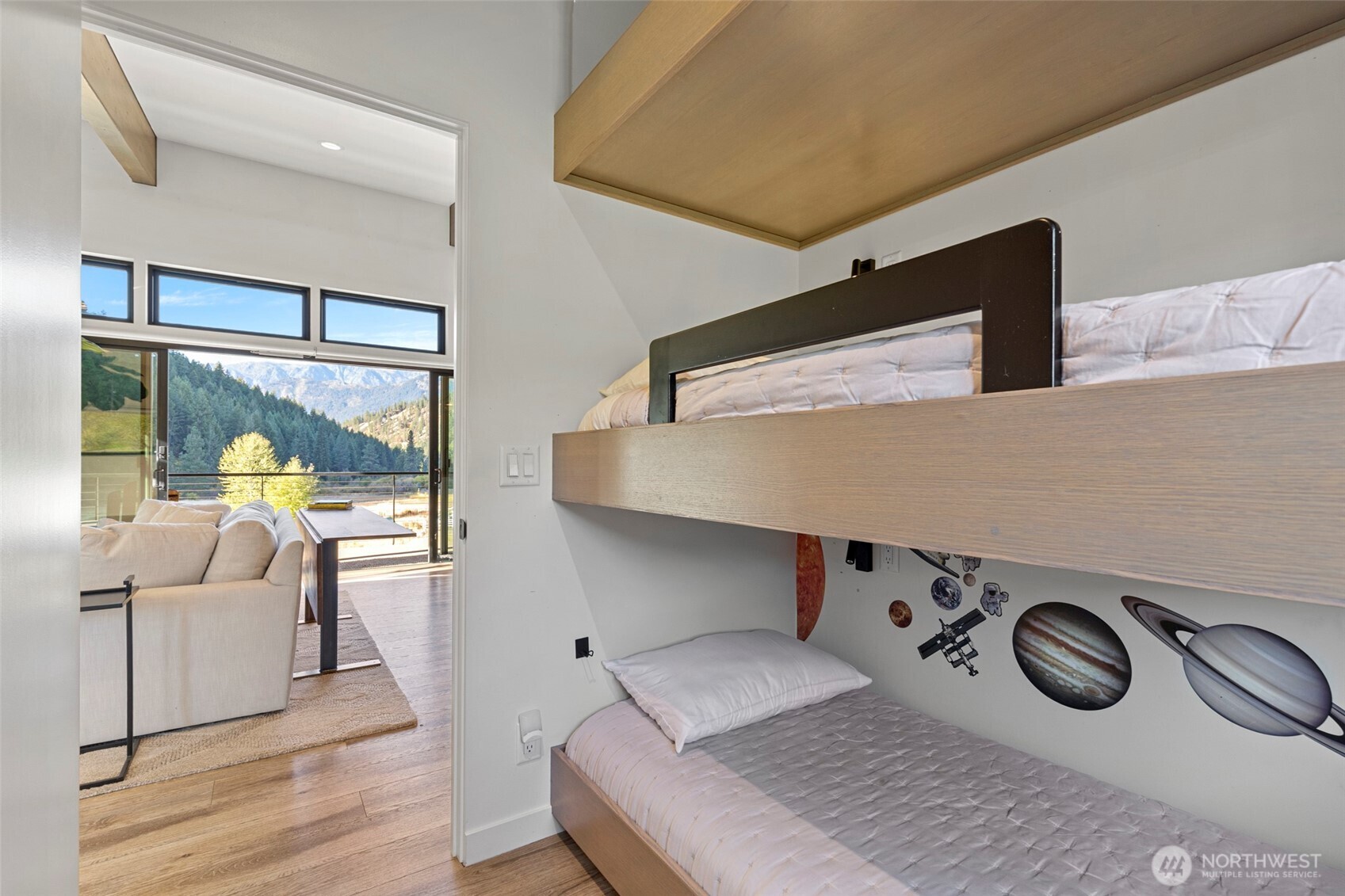 10695 Eagle Creek Road Leavenworth, WA 98826 - Photo 26 of 39 a bedroom with a bed and a large window