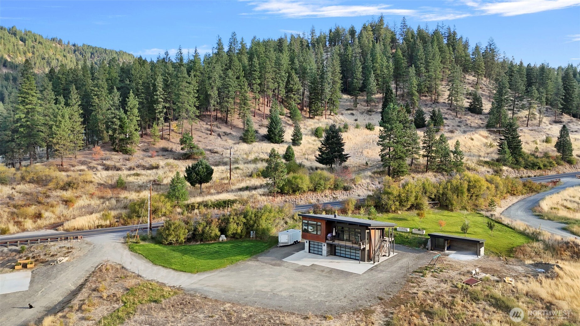 10695 Eagle Creek Road Leavenworth, WA 98826 - Photo 36 of 39 a view of a bench in the middle of a yard