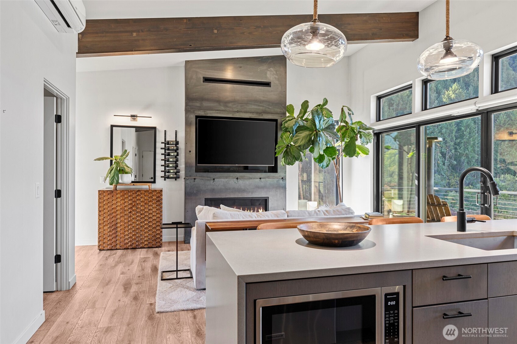 10695 Eagle Creek Road Leavenworth, WA 98826 - Photo 10 of 39 a kitchen with a chandelier a sink and living room view
