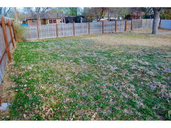 a view of backyard with green space