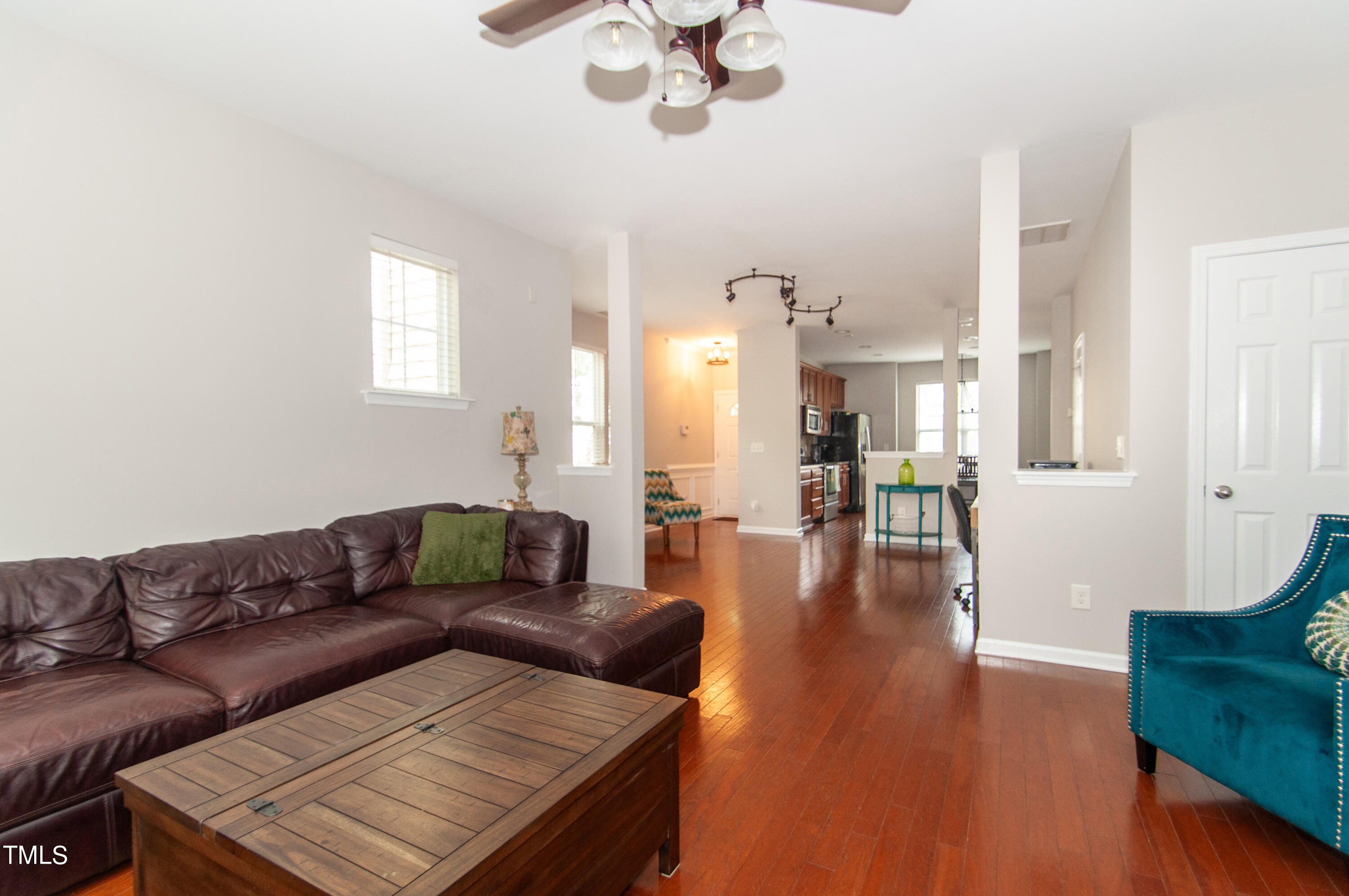 6612 Clarksburg Place Raleigh, NC 27616 - Photo 5 of 30 a living room with furniture and a wooden floor