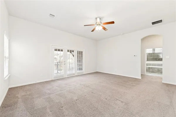 a view of an empty room with a window