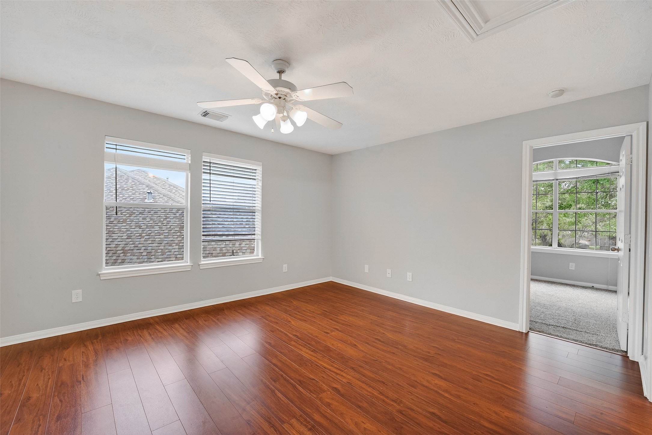 14308 Rocky Briar Lane Rosharon, TX 77583 - Photo 33 of 46 a view of an empty room with wooden floor and a window