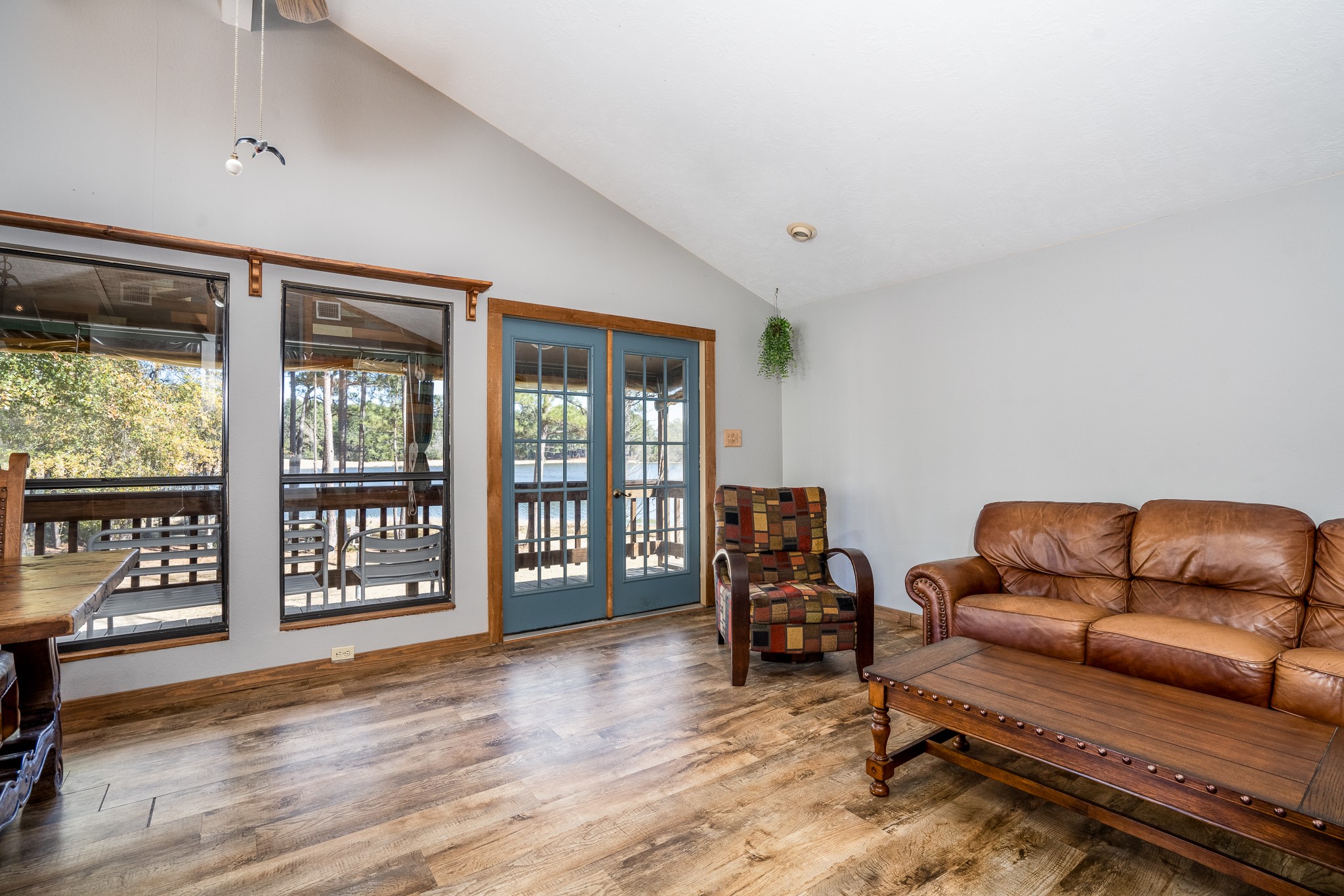 97 Greenway Drive Trinity, TX 75862 - Photo 12 of 49 a living room with furniture and a floor to ceiling window