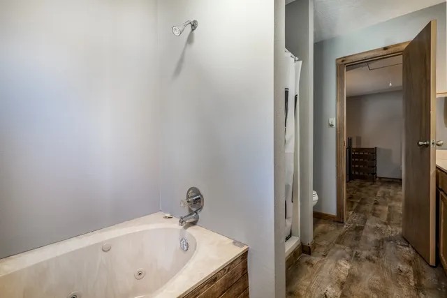 a bathroom with a tub and a sink