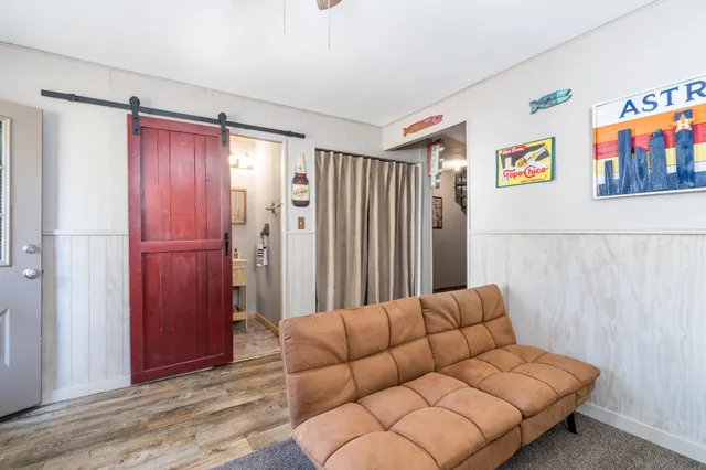 a living room with furniture and a closet