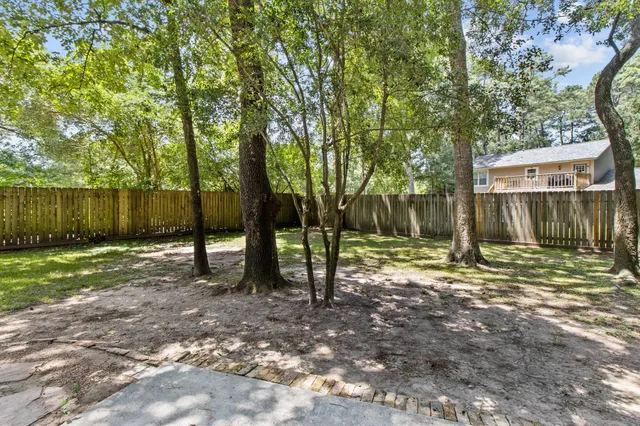 a backyard of a house with lots of green space