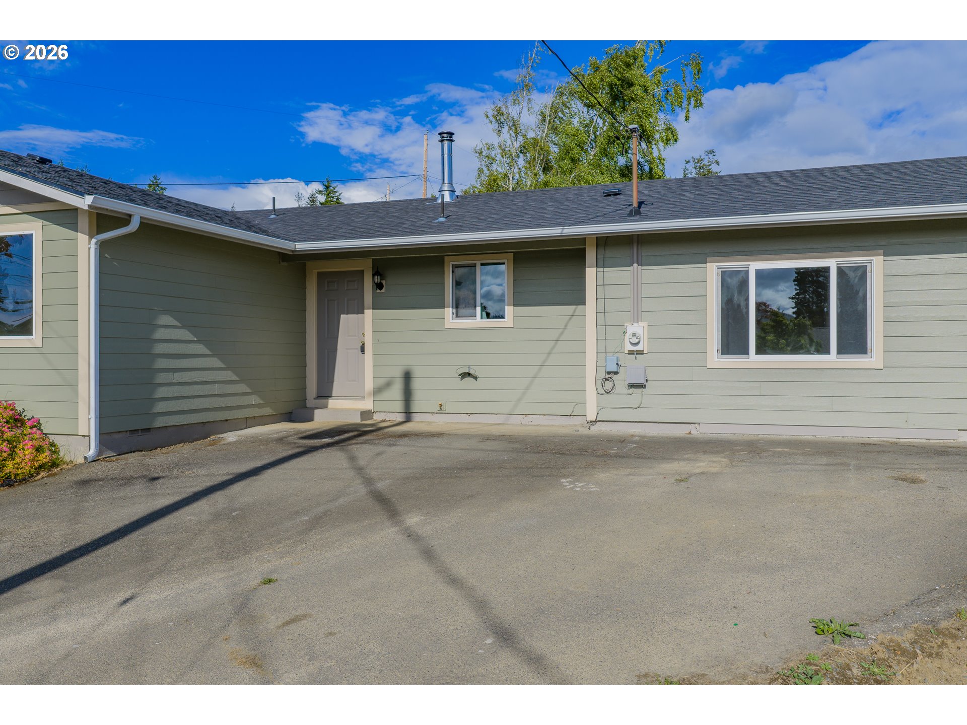 1816 Sunset Court Myrtle Point, OR 97458 - Photo 5 of 42 a view of a house with a garage