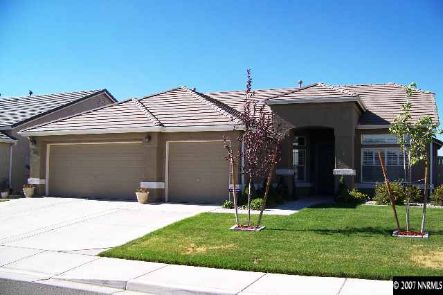 1635 Arboleda Drive Reno, NV 89521 - Photo 1 of 9 a front view of a house with a garden and plants