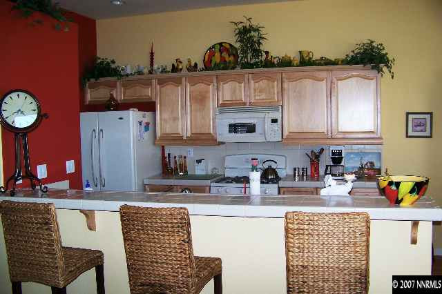 1635 Arboleda Drive Reno, NV 89521 - Photo 2 of 9 a kitchen with a cabinets and a stove top oven