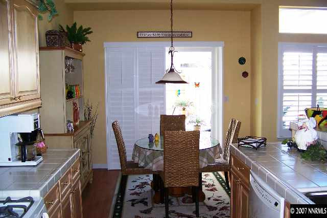 1635 Arboleda Drive Reno, NV 89521 - Photo 3 of 9 a view of a dining room with furniture and a chandelier
