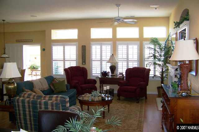 1635 Arboleda Drive Reno, NV 89521 - Photo 5 of 9 a living room with furniture fireplace and a large window