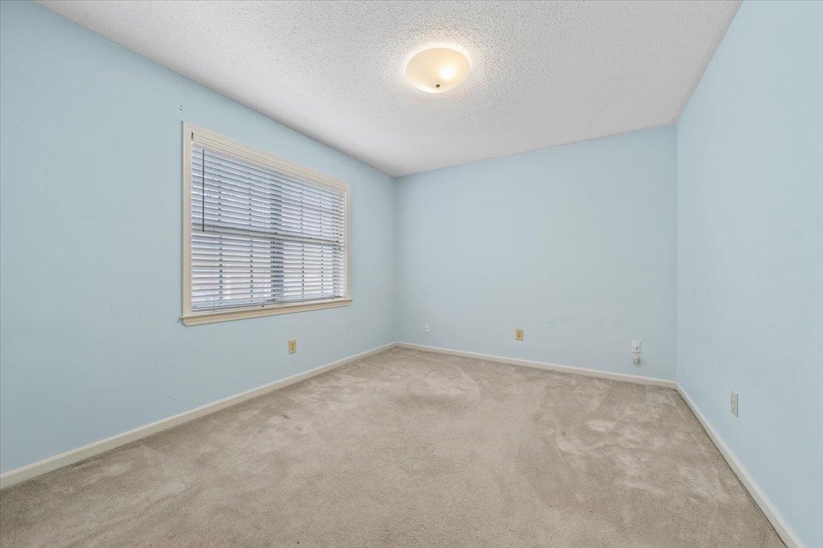 2587 McVay Road Memphis, TN 38119 - Photo 23 of 35 Bedroom with a textured ceiling and light carpet
