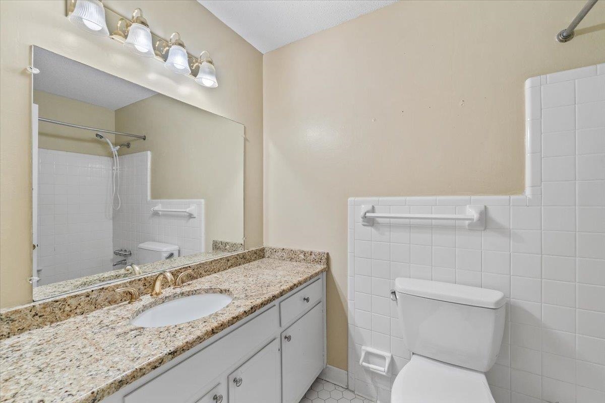 2587 McVay Road Memphis, TN 38119 - Photo 24 of 35 Full bathroom with vanity and tile walls
