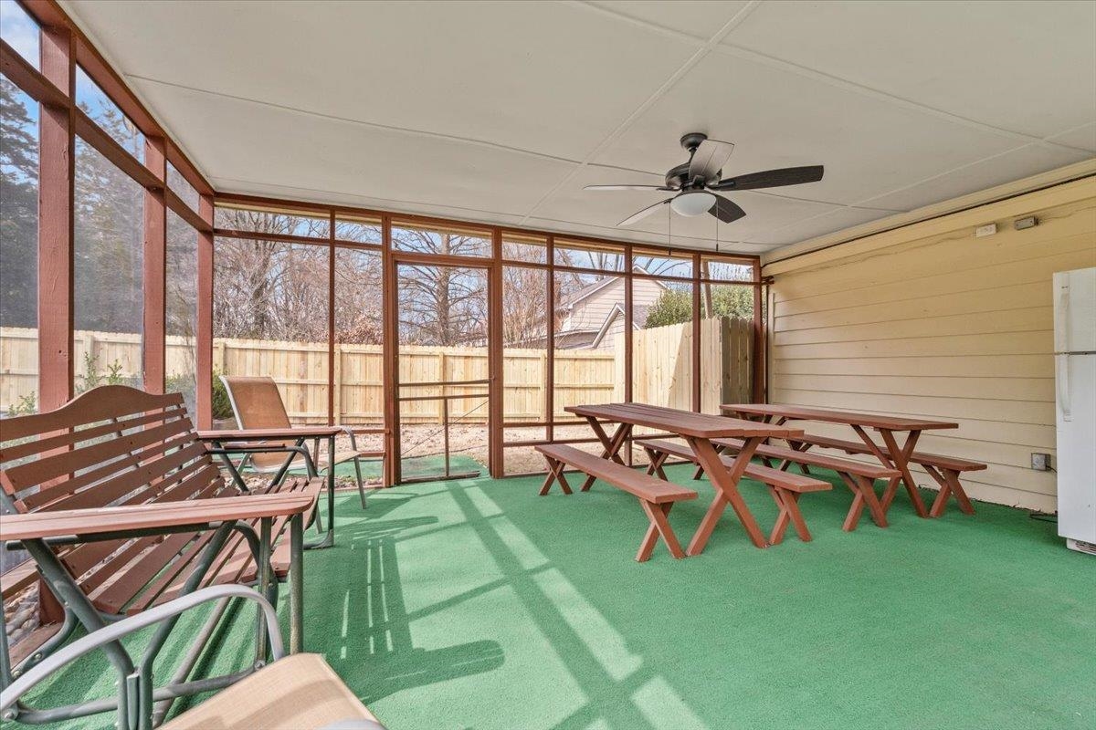 2587 McVay Road Memphis, TN 38119 - Photo 26 of 35 Screenporch with outdoor dining area and a ceiling fan
