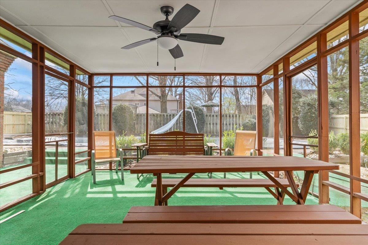 2587 McVay Road Memphis, TN 38119 - Photo 27 of 35 Screenporch with a ceiling fan and outdoor dining space