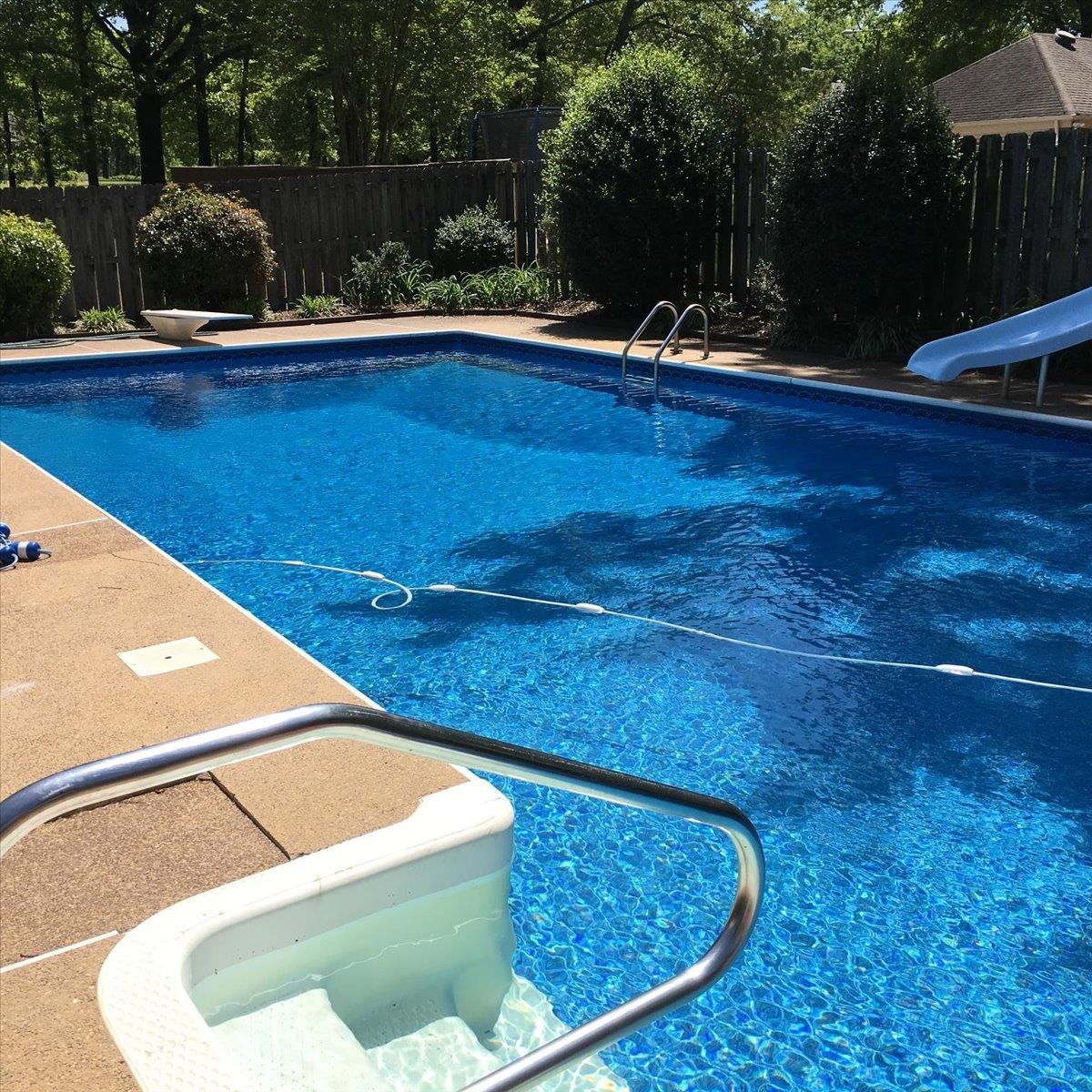 2587 McVay Road Memphis, TN 38119 - Photo 32 of 35 Photo taken in the summer. View of swimming pool featuring a fenced backyard and a water slide