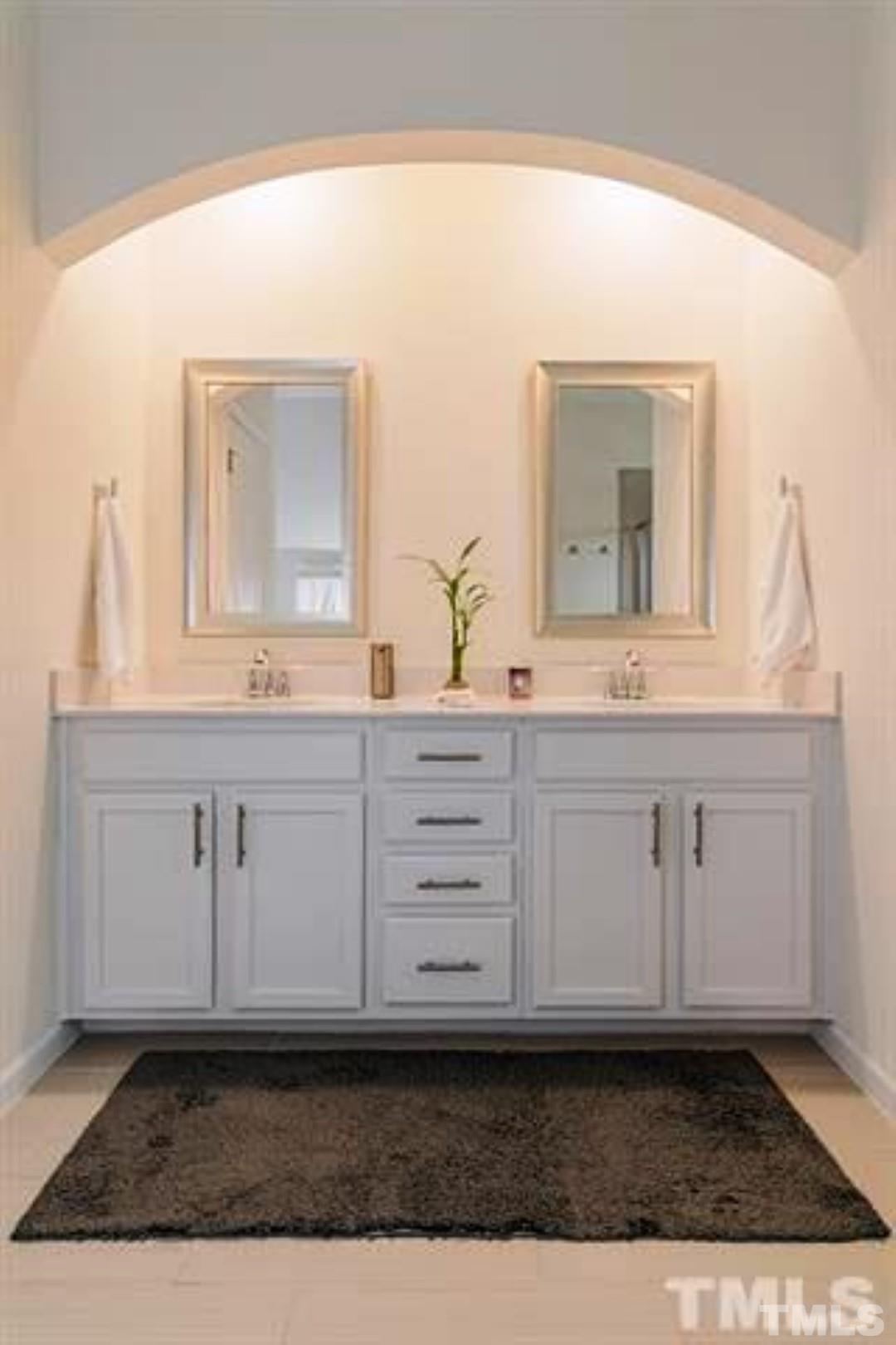 1118 Epiphany Road Morrisville, NC 27560 - Photo 13 of 20 a bathroom with a sink and a mirror