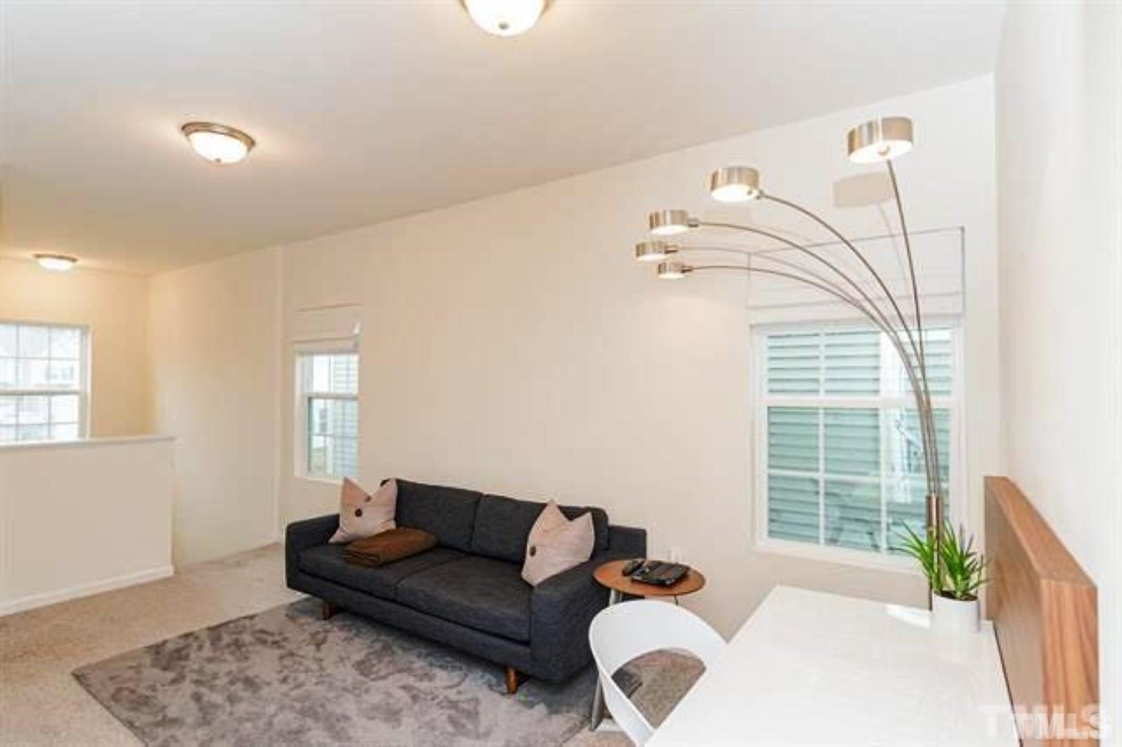 1118 Epiphany Road Morrisville, NC 27560 - Photo 14 of 20 a living room with furniture and a window
