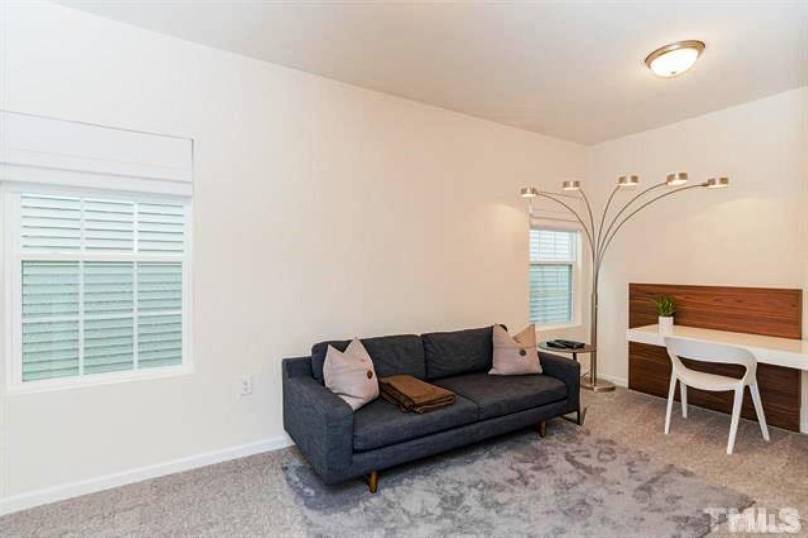 1118 Epiphany Road Morrisville, NC 27560 - Photo 15 of 20 a living room with furniture and a window