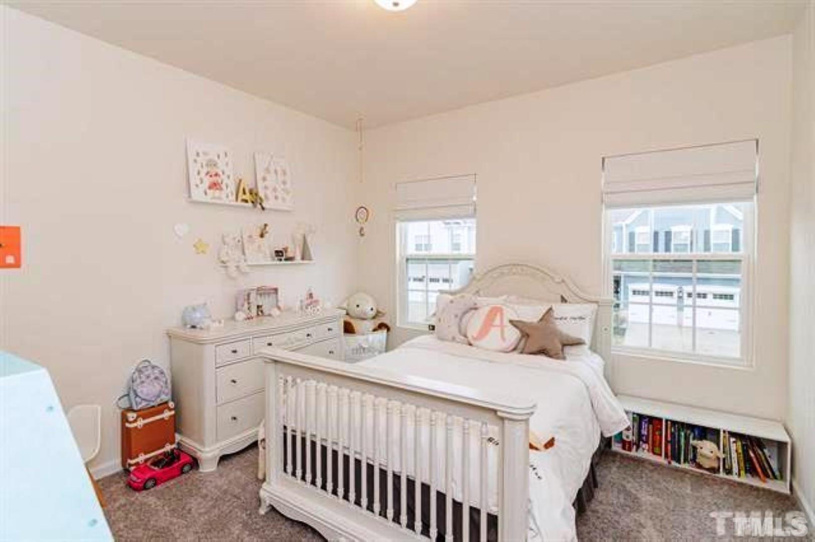 1118 Epiphany Road Morrisville, NC 27560 - Photo 16 of 20 a bedroom with a bed and a window